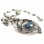Thick silver plated brass & copper alloy necklace with glass cabochon stones.